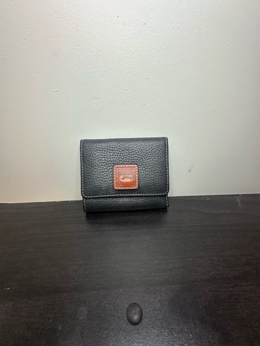 Dooney & Bourke Black Pebbled Wallet with Brown Logo Patch